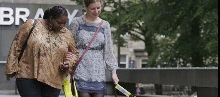 Photo of a blind girl at the University's main library