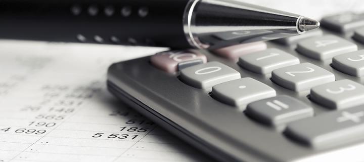 Calculator & pen with spreadsheet