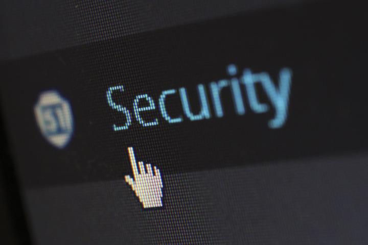 A stock image of a lock on a blue computer screen