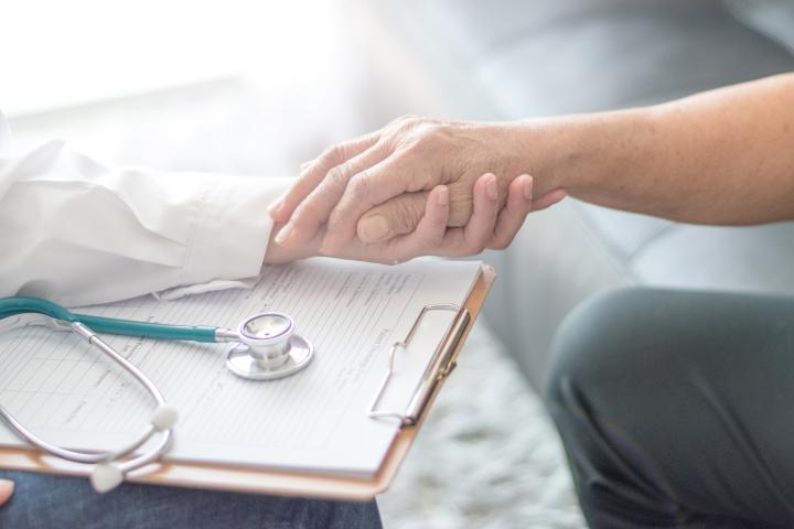 Doctor comforts a patient in hospital