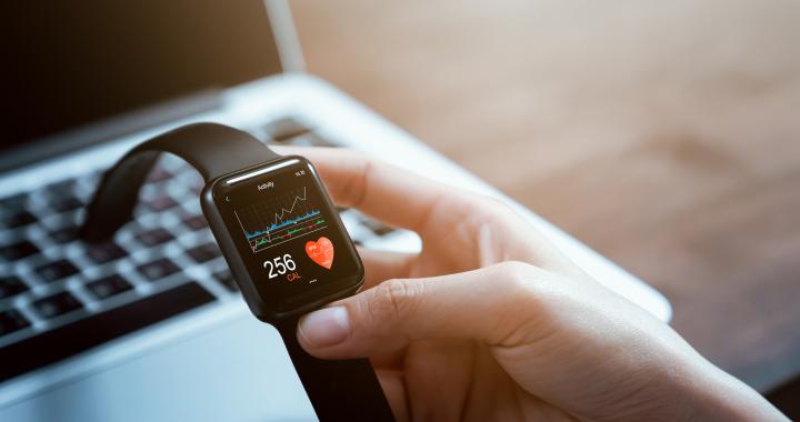 Stock image of person holding a smartwatch