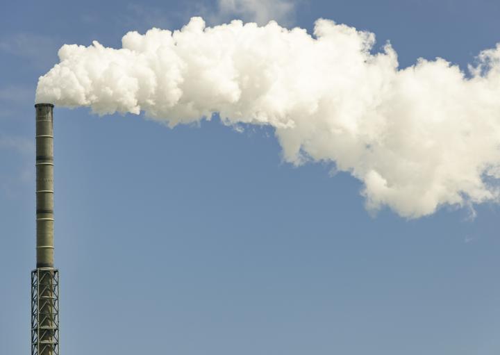Image of emissions coming from a chimney stack