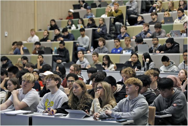 A lecture theatre full of students seen from the point of view of a lecturer.