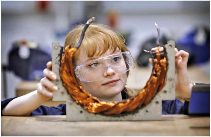 A female student works on a piece of equipment in a lab that forms part of the HYPED project