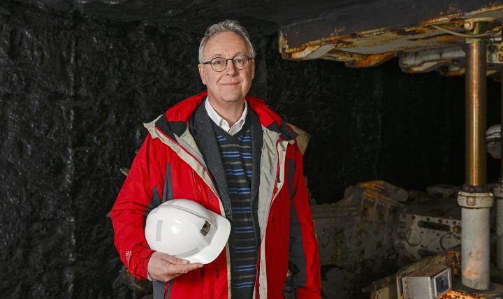 A head and shoulders photo of Professor Chris McDermott at the National Mining Museum