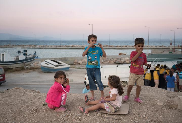 Refugee children by the sea in Greece