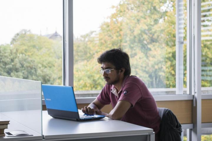 Student on laptop in library