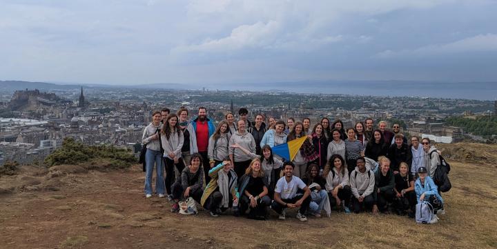 A group of students who participated in Una Europa's One Health Summer School posing for a photo on Salisbury Crags