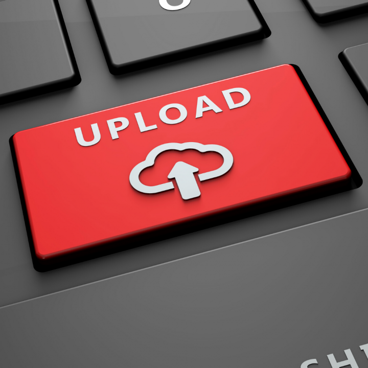 Red upload button on a black keyboard