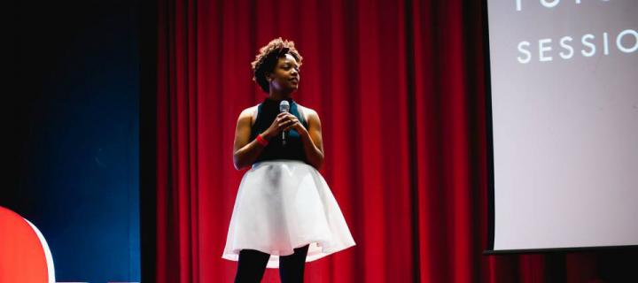 Briana Pegado giving a TedX talk