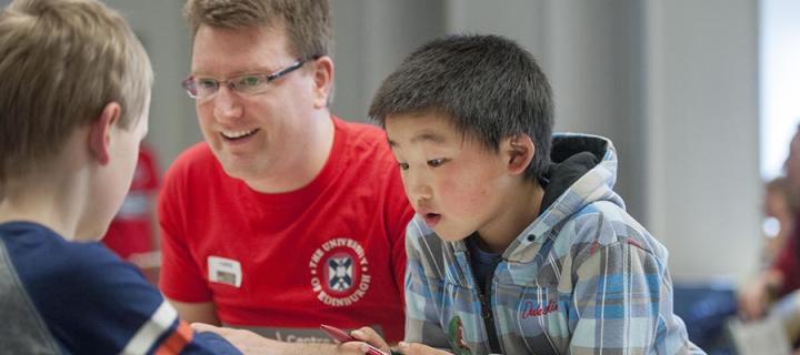 Image of children and tutor taking part in public engagement event