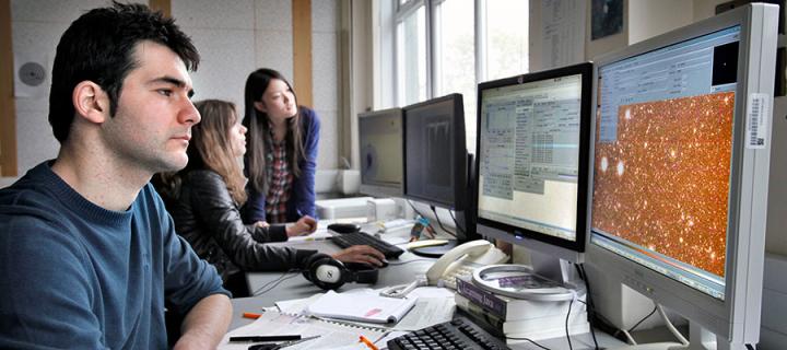 Photo of an Astronomy student working on a computer