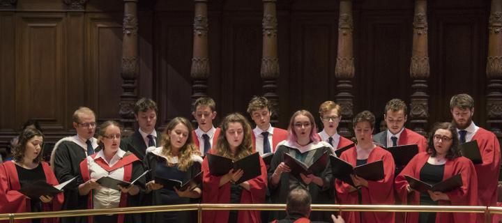 Students singing in the McEwan Hall