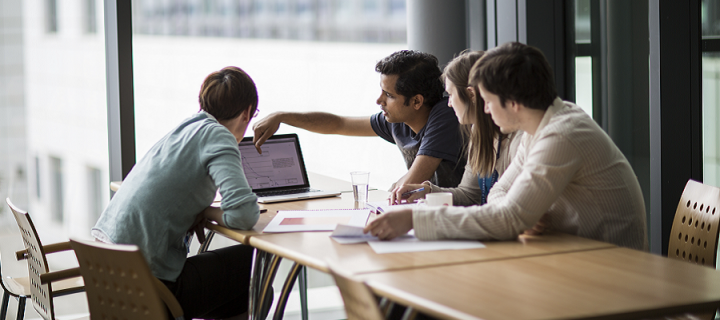 Image of members have a round the table meeting