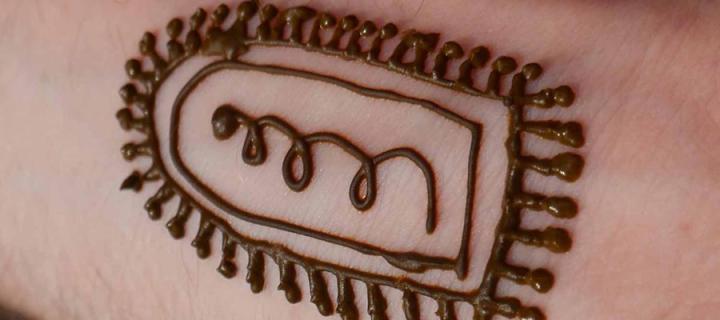 Henna tattoo, of a cell, on an arm
