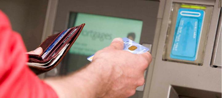 person using and ATM