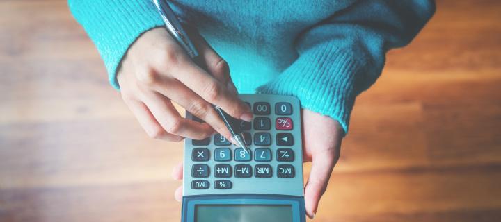 Person with a calculator