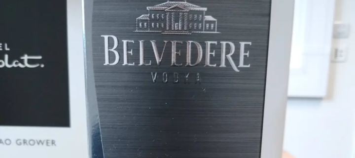 Photo of a Belvedere vodka bottle box and a hotel chocolat box behind it