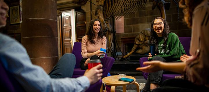 Students sharing a coffee and a joke