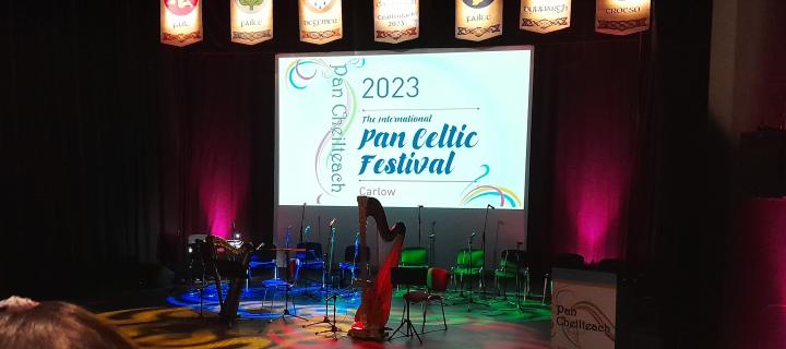 Main stage at the International Pan Celtic Festival with harp in foreground