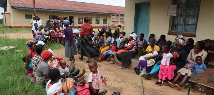 Photo of a group of people outside a clinic in Zimbabwe