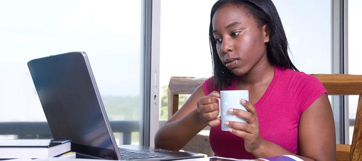 Photo of a woman using a laptop