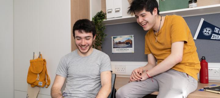 Students chatting in University of Edinburgh accommodation.