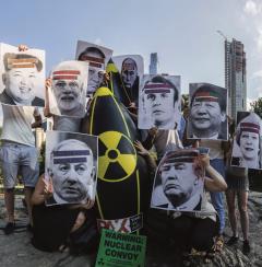 A prop bomb with pictures of the leaders of nuclear powers