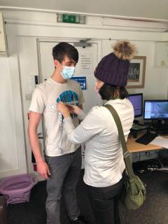 Grassroots charity hold suit fitting with service user