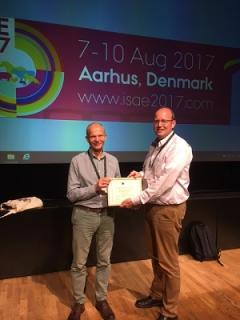 Professor Alistair Lawrence is presented with an ISAE award