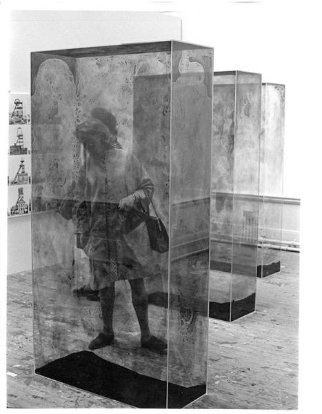 The art critic Cordelia Oliver among glass containers by Erich Reusch and photographs by Bernd and Hilla Becher in studio E.25. 