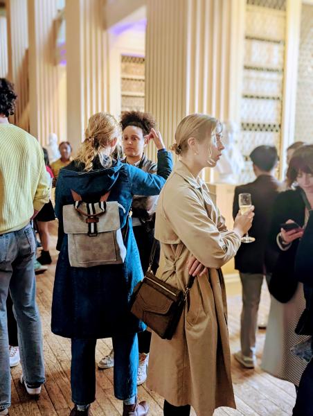 Postgraduate students chat in Playfair Library