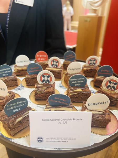 Cakes decorated with University of Edinburgh branding and congratulation messages