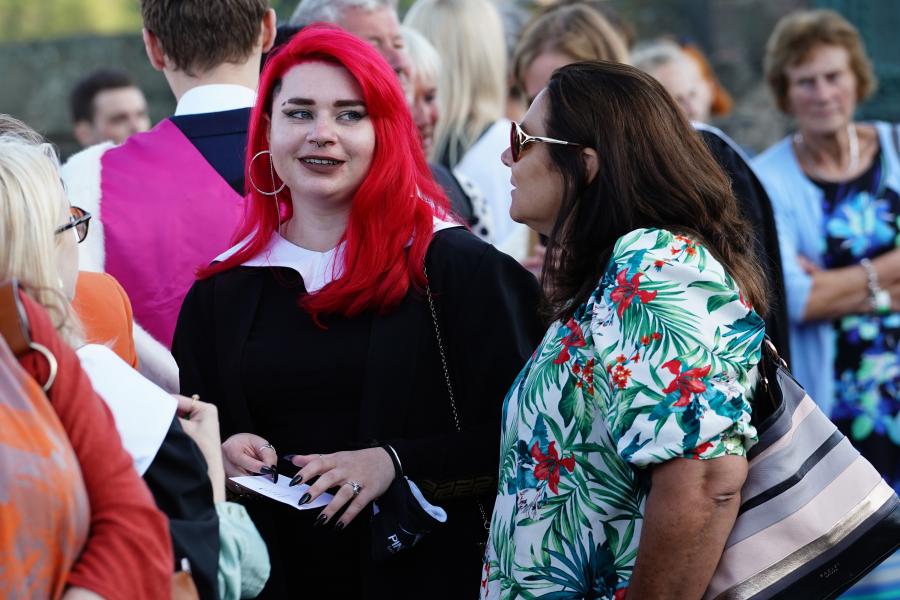 Graduates and their families gather at the castle