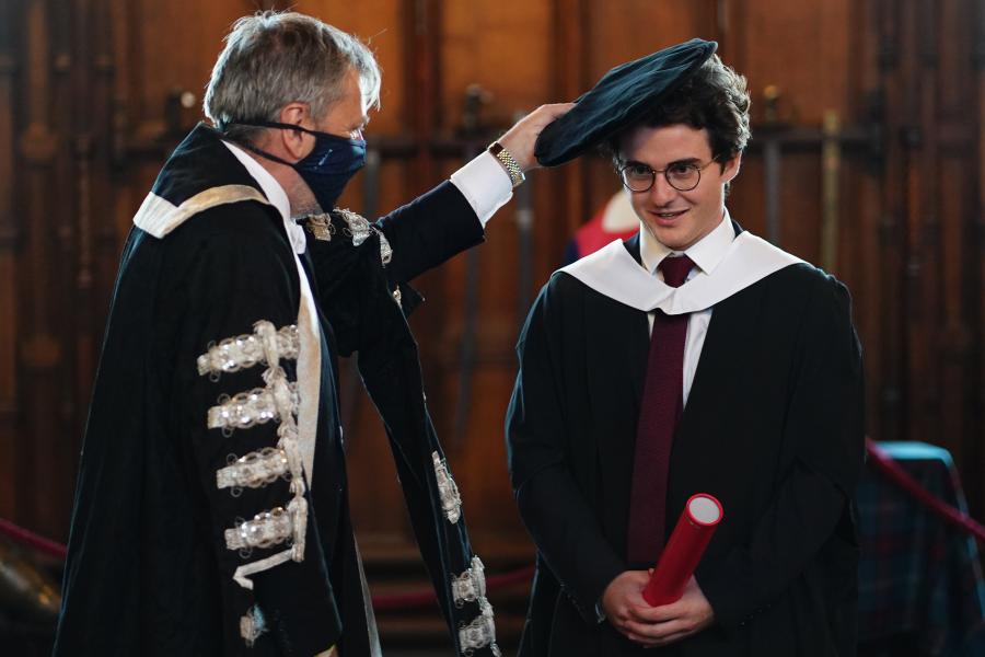 The Principal caps a graduate