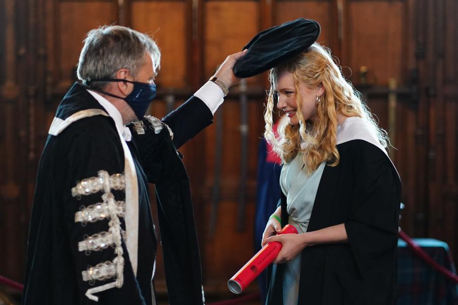 The Principal caps an Alumna