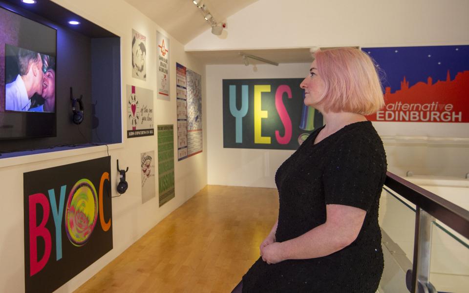 Side profile of a person stood in front of an exhibition piece by artist Eothen Stearn